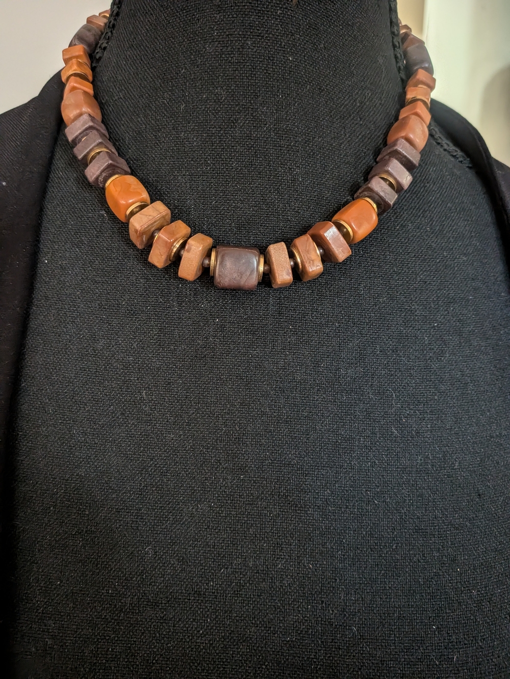 wood beaded necklace features a Handcrafted Polished Brown Bead Necklace -
